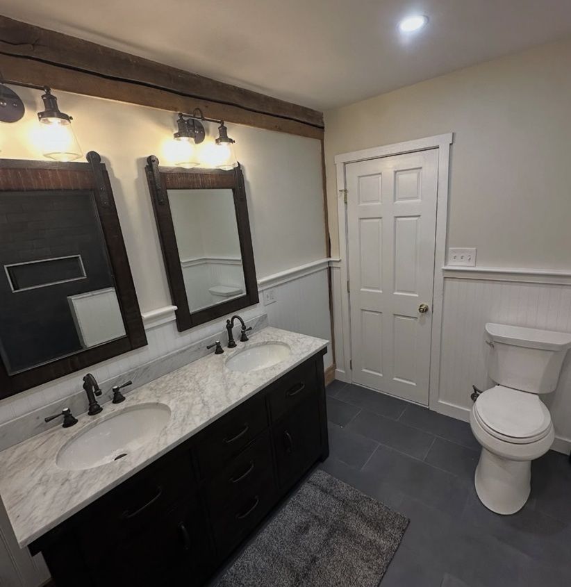 View of bathroom vanity and toilet | James Hardie Siding Contractor Chadds Ford | Kenny Construction Group
