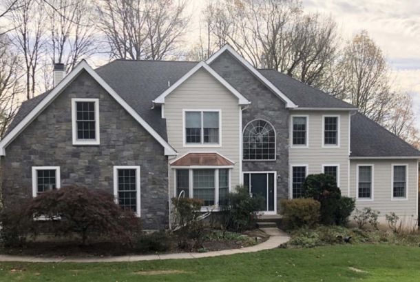 View of house after stucco and siding replacement | James Hardie Siding Contractor Lionville | Kenny Construction Group